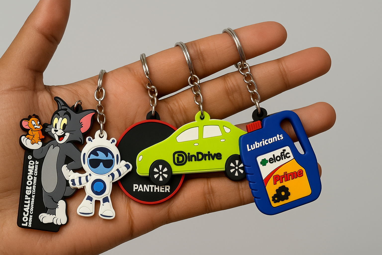 Bunch of Colorful Keychains in Hand.png__PID:577d1170-e8f1-445f-9772-136680b8e30e